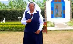 Sr. Kachope, Headmistress, speaking in the school grounds